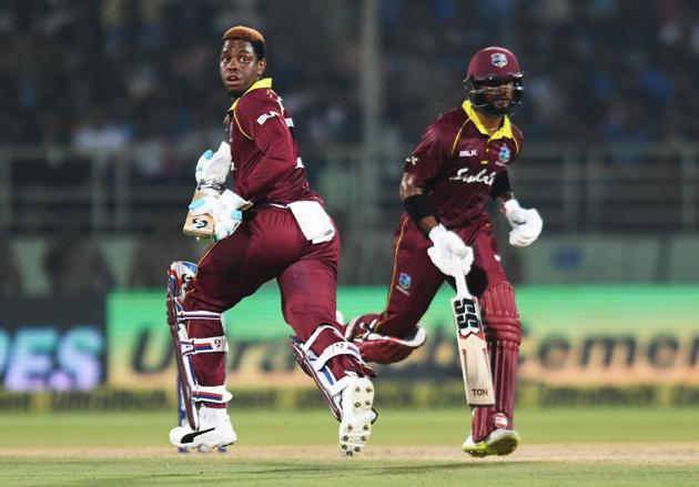 West Indies cricketers Shai Hope (R) and Shimron Hetmyer run between the wickets during the second one day international (ODI) cricket match between India and West Indies at the Dr. Y.S. Rajasekhara Reddy ACA-VDCA Cricket Stadium in Visakhapatnam. (AFP)