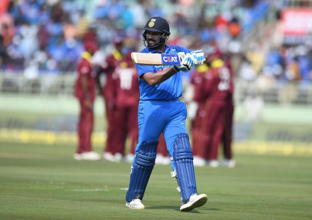 Indian cricketer Rohit Sharma walks back to the pavillion during the second one day international (ODI) cricket match between India and West Indies at the Dr. Y.S. Rajasekhara Reddy ACA-VDCA Cricket Stadium in Visakhapatnam. (AFP)