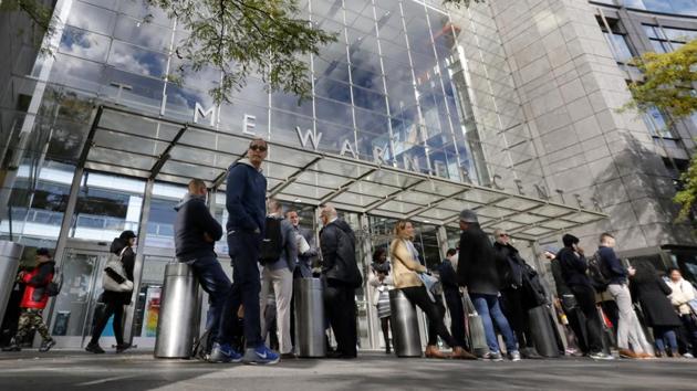 People gather outside the Time Warner Center, in New York on October 24.(AP Photo) People gather outside the Time Warner Center, in New York on October 24.(AP Photo)