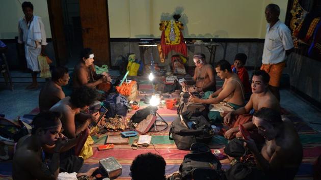 A troupe prepares backstage ahead of a performance. Traditionally presented from dusk to dawn, Yakshagana performances use song, dance, dialogue and theatrics to present tales from classical epics like Mahabharata, Ramayana and other Hindu and Jain texts. Performances begin with a preliminary prayer to Ganesha in the dressing room. (Manjunath Kiran / AFP) A troupe prepares backstage ahead of a performance. Traditionally presented from dusk to dawn, Yakshagana performances use song, dance, dialogue and theatrics to present tales from classical epics like Mahabharata, Ramayana and other Hindu and Jain texts. Performances begin with a preliminary prayer to Ganesha in the dressing room. (Manjunath Kiran / AFP)