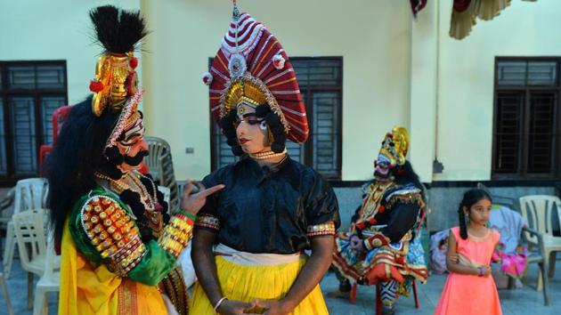 Artists backstage before a performance. Training is often years long and in the form of an apprenticeship. The method of instruction is observational, and the student takes on roles, growing from a minor stage presence to male or female leads depending on aptitude and oratory prowess. Actors branch out into specialist roles depending on improvisation skills and physical attributes. (Manjunath Kiran / AFP) Artists backstage before a performance. Training is often years long and in the form of an apprenticeship. The method of instruction is observational, and the student takes on roles, growing from a minor stage presence to male or female leads depending on aptitude and oratory prowess. Actors branch out into specialist roles depending on improvisation skills and physical attributes. (Manjunath Kiran / AFP)