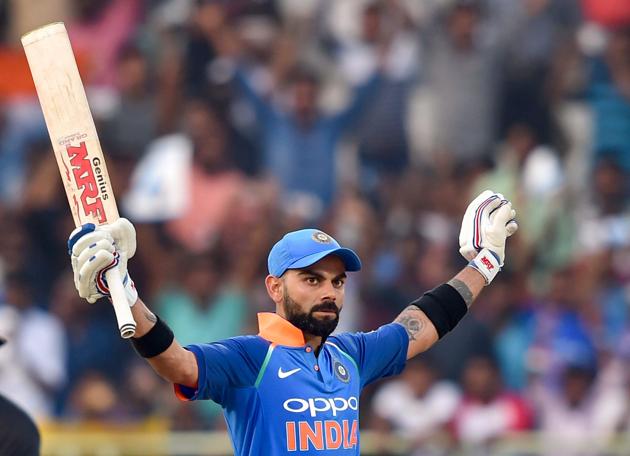 Visakhapatnam: Indian batsman Virat Kohli celebrates his century during the 2nd ODI cricket match against West Indies in Visakhapatnam. (PTI)