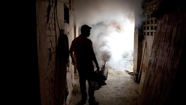 A municipal worker fumigates a residential area to check the spread of mosquito-borne diseases in New Delhi. (AP Photo) A municipal worker fumigates a residential area to check the spread of mosquito-borne diseases in New Delhi. (AP Photo)