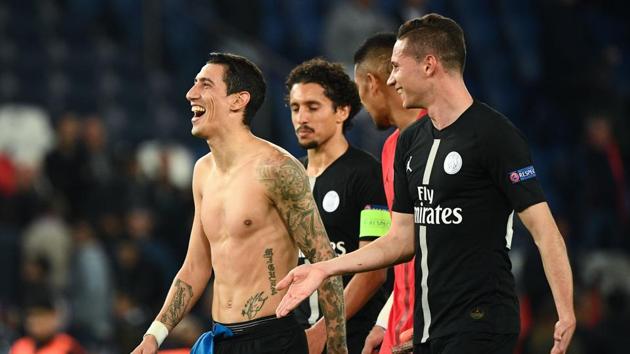 Paris Saint-Germain's midfielder Angel Di Maria (left) reacts with teammates at the end of the game against SSC Napoli. (AFP) Paris Saint-Germain's midfielder Angel Di Maria (left) reacts with teammates at the end of the game against SSC Napoli. (AFP)