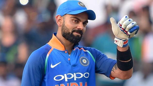 Virat Kohli reacts after completing his 10,000 runs in ODI, during the 2nd ODI cricket match against West Indies in Visakhapatnam.(PTI)