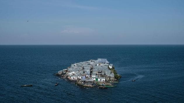 A rounded rocky outcrop covered with metallic shacks, Migingo Island rises out of the waters of Lake Victoria like an iron-plated turtle. The densely populated island is barely a quarter of a hectare large, its residents crammed into a hodge-podge of corrugated-iron homes. There’s little else but a few bars, brothels and a tiny port. (Yasuyoshi Chiba / AFP)
