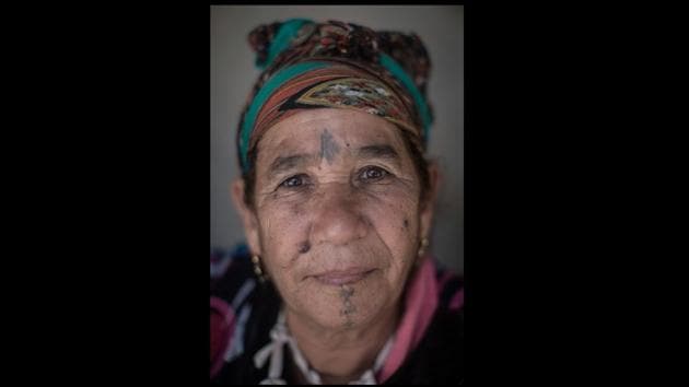 Portrait of 63-year-old Fatima Hadeoui.Today, as tattoos etched decades ago grow fainter on the faces of women grown old, so, too, have they waned in social acceptance. In Morocco, wearing “ouchem” now is generally seen as outdated or worse. (Mosa'ab Elshamy / AP)