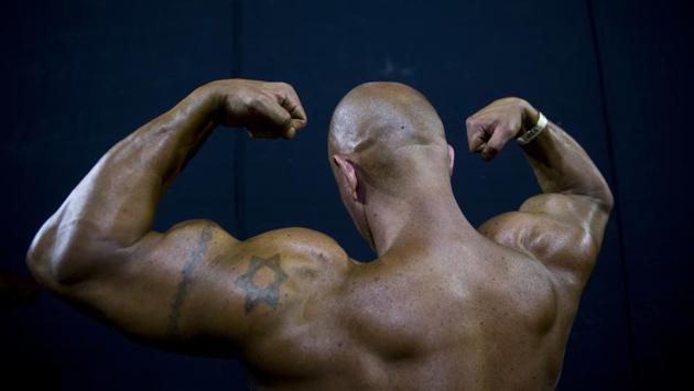A contestant exercises backstage during the National Amateur Body Builders’ Association competition in Tel Aviv, Israel. (Oded Balilty / AP) A contestant exercises backstage during the National Amateur Body Builders’ Association competition in Tel Aviv, Israel. (Oded Balilty / AP)