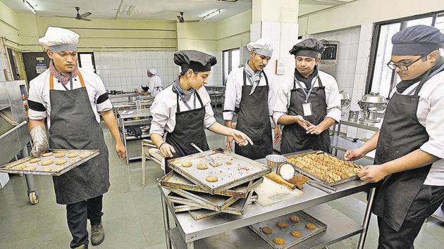 Students make biscuits and cookies at Tilak Maharashtra Vidyapeeth in Pune. (Pratham Gokhale/HT Photo) Students make biscuits and cookies at Tilak Maharashtra Vidyapeeth in Pune. (Pratham Gokhale/HT Photo)