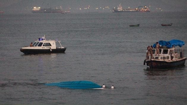 Rescuers tow the capsized boat on soon after the accident.(PTI)