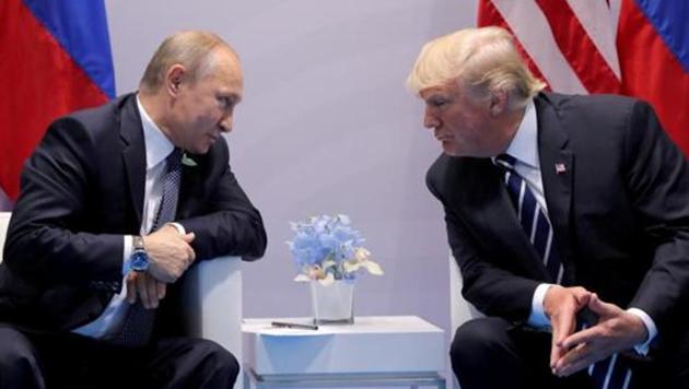 Russia's President Vladimir Putin talks to U.S. President Donald Trump during their bilateral meeting at the G20 summit in Hamburg, Germany, July 7, 2017. REUTERS/Carlos Barria/Files (Reuters File Photo) Russia's President Vladimir Putin talks to U.S. President Donald Trump during their bilateral meeting at the G20 summit in Hamburg, Germany, July 7, 2017. REUTERS/Carlos Barria/Files (Reuters File Photo)