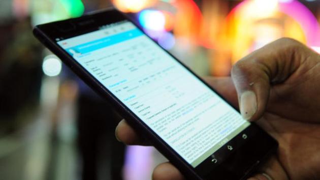 A passenger using mobile phone for electronic ticketing system at Howrah Station in Howrah. (Hindustan Times via Getty Images) A passenger using mobile phone for electronic ticketing system at Howrah Station in Howrah. (Hindustan Times via Getty Images)