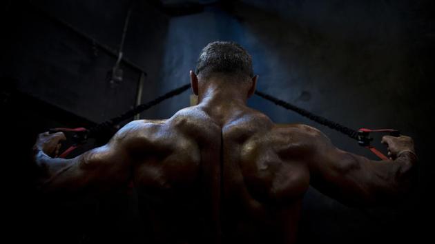 A contestant flexes backstage during the National Amateur Body Builders’ Association competition in Tel Aviv, Israel. Dozens of glistening competitors took the stage for the annual body building and fitness competition last week. But behind the scenes, machismo made way for cooperation. (Oded Balilty / AP) A contestant flexes backstage during the National Amateur Body Builders’ Association competition in Tel Aviv, Israel. Dozens of glistening competitors took the stage for the annual body building and fitness competition last week. But behind the scenes, machismo made way for cooperation. (Oded Balilty / AP)