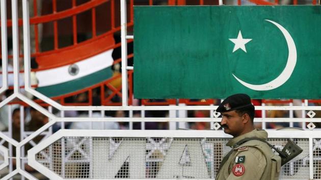 A Pakistani Ranger stands near the Pakistani flag and Indian flag (L) during a daily parade at the Pakistan-India joint check post at Wagah border, February 26, 2010 (REUTERS) A Pakistani Ranger stands near the Pakistani flag and Indian flag (L) during a daily parade at the Pakistan-India joint check post at Wagah border, February 26, 2010 (REUTERS)