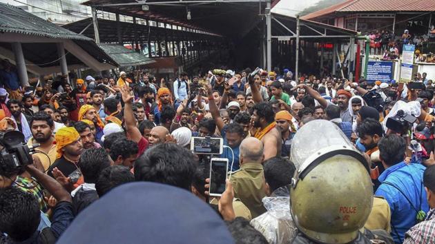 Protesters oppose the entry of women to the Sabarimala Temple in Kerala on October 19. (PTI Photo) Protesters oppose the entry of women to the Sabarimala Temple in Kerala on October 19. (PTI Photo)