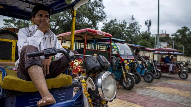 E-rickshaw drivers wait for passengers at a stand in New Delhi, India, on Saturday, Sept. 22, 2018. The South Asian nation is home to about 1.5 million battery-powered, three-wheeled rickshaws – a fleet bigger than the total number of electric passenger cars sold in China since 2011. (Prashanth Vishwanathan / Bloomberg) E-rickshaw drivers wait for passengers at a stand in New Delhi, India, on Saturday, Sept. 22, 2018. The South Asian nation is home to about 1.5 million battery-powered, three-wheeled rickshaws – a fleet bigger than the total number of electric passenger cars sold in China since 2011. (Prashanth Vishwanathan / Bloomberg)
