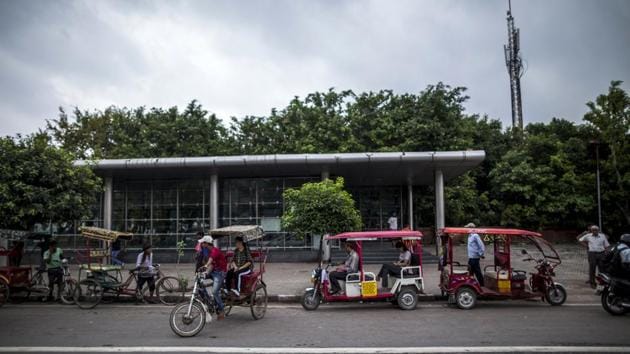 Outside an east Delhi metro station, a slew of partly open-air vehicles line the street as commuters hail their rides. They also carry tourists, schoolchildren, crates of fruit and the occasional goat. Anil Chaudhary, 32, switched to an e-rickshaw from a cycle model two years ago. His income increased, he’s able to take longer breaks and he sends money to his wife and three children in Bihar. He’s already on his second electric model. (Prashanth Vishwanathan / Bloomberg) Outside an east Delhi metro station, a slew of partly open-air vehicles line the street as commuters hail their rides. They also carry tourists, schoolchildren, crates of fruit and the occasional goat. Anil Chaudhary, 32, switched to an e-rickshaw from a cycle model two years ago. His income increased, he’s able to take longer breaks and he sends money to his wife and three children in Bihar. He’s already on his second electric model. (Prashanth Vishwanathan / Bloomberg)