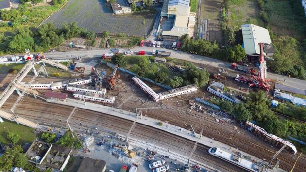 An aerial view shows carriages of the Puyuma Express train in Taiwan’s northeastern Yilan county, a day after the train derailed at high speed near Xinma station, in the island’s worst rail accident for more than 25 years. (Daniel Shih / AFP) An aerial view shows carriages of the Puyuma Express train in Taiwan’s northeastern Yilan county, a day after the train derailed at high speed near Xinma station, in the island’s worst rail accident for more than 25 years. (Daniel Shih / AFP)