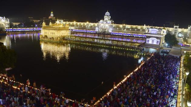 An illuminated Golden Temple on the occasion of the birth anniversary of fourth Sikh Guru, Guru Ramdass Ji, in Amritsar on Friday. (Sameer Sehgal/HT)