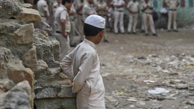 A boy looks at the police deployment in south Delhi’s Malviya Nagar on Thursday. (Burhaan Kinu/HT PHOTO) A boy looks at the police deployment in south Delhi’s Malviya Nagar on Thursday. (Burhaan Kinu/HT PHOTO)