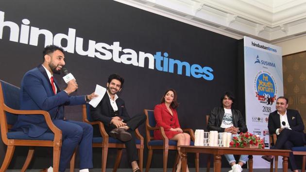 (Left to Right) RJ Rahul Makin with panellists actor Kartik Aaryan, actress Yami Gautam, athlete Neeraj Chopra and cricketer Virender Sehwag during the 7th edition of HT Youth Forum 30-under-30 2018 event held in Chandigarh on Friday. The panellists discussed if India’s demographic dividend has really delivered. (Sanjeev Sharma/HT)