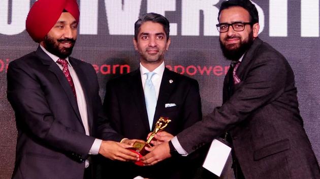 Chief guest Abhinav Bindra presenting an award to Anjum Bashir Khan, who topped the Kashmir Administrative Services exams, during the HT youth Forum 2018 in Chandigarh on Friday. (Keshav Singh/ht)