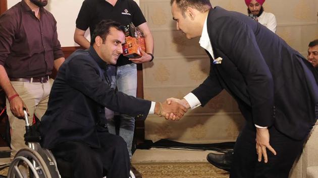 Para athlete Amit Balyan interacting with cricketer Virender Sehwag during the event. (Keshav Singh)
