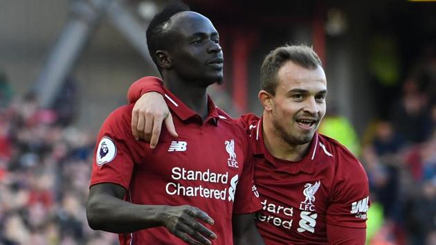 Liverpool's Senegalese striker Sadio Mane (L) celebates scoring their fourth goal.(AFP)