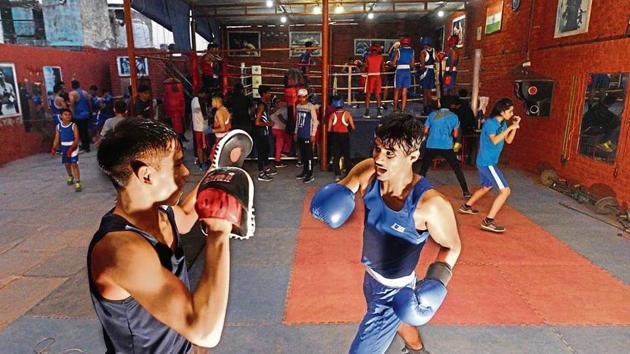 Aspiring boxers sweat it out at Najafgarh Boxing Academy. (Vipin Kumar/HT PHOTO) Aspiring boxers sweat it out at Najafgarh Boxing Academy. (Vipin Kumar/HT PHOTO)