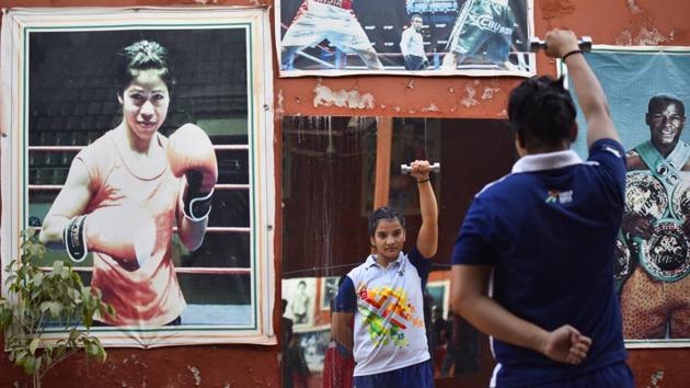Bollywood has also played a big role in popularising the sport, with several boxing-related movies --like Mary Kom, Mukkabaaz , Saala Khadoos -- becoming major hits. “Youngsters in this predominately rural area are intelligent, well- built, and have a fighting spirit. It is an aspirational sport for them,” says Brij Mohan, whose new academy attracts children from many neighbouring villages. (Vipin Kumar / HT Photo) 