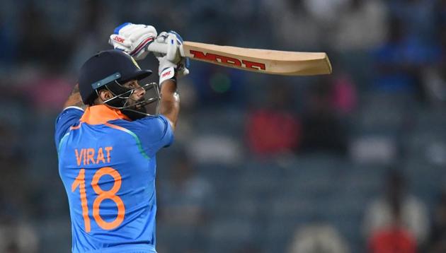 India captain Virat Kohli plays a shot during the third one day international (ODI) cricket match between India and West Indies at the Maharashtra Cricket Association Stadium in Pune(AFP)