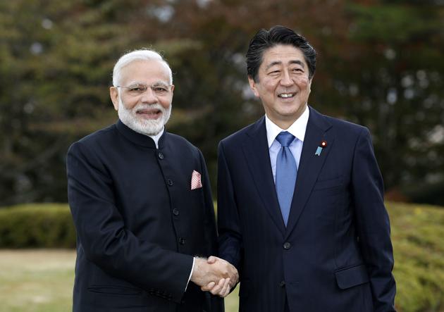 Prime Minister Narendra Modi shakes hands with Japan's Prime Minister Shinzo Abe in Yamanakako village, Yamanashi prefecture, Sunday, Oct. 28, 2018.(AP/Kyodo News)