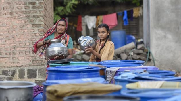 While only 237 tankers have been pressed into service so far in Marathwada with Aurangabad district getting the larger share of 195, officials said this figure could multiply by five times over next summer. The big job for villagers who have stayed back is to ensure that they don’t miss the tankers. But, just when one could make its way to the village, is anyone’s guess. (Kunal Patil / HT Photo) 