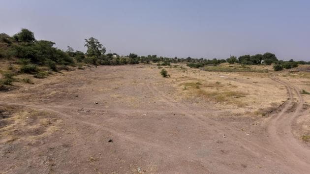A view of a dried-up local tributary of the Godavari River, in Aurangabad district. 266km from Aurangabad city, alarm bells started ringing in Kamkheda when the retreating monsoon also failed this month. Drinking-water supply threatens to run out any day now and a 1,000-litre water tank costs ₹300. The village’s proposal asking for tankers, has so far not been granted by the district collectorate. (Kunal Patil / HT Photo) 