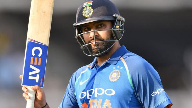 Rohit Sharma gestures towards the crowd as he walks back towards the pavilion against West Indies.(AFP)