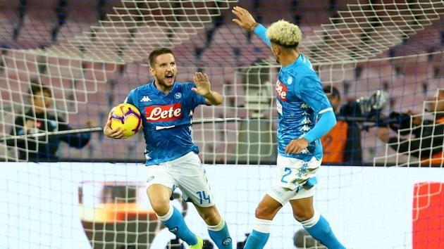 Napoli's Belgian forward Dries Mertens (left) celebrates with teammate Kevin Malcuit after scoring against AS Roma.(AFP)