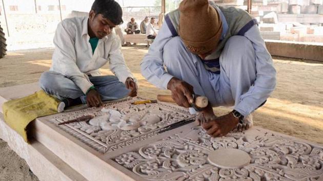 A stone’s throw away from Karsevakpuram is a workshop where volunteers and workers toil away for hours chiseling massive slabs of stone and wood into ready-to-move building blocks for the temple — a project that has been going on for more than a decade. (PTI) A stone’s throw away from Karsevakpuram is a workshop where volunteers and workers toil away for hours chiseling massive slabs of stone and wood into ready-to-move building blocks for the temple — a project that has been going on for more than a decade. (PTI)