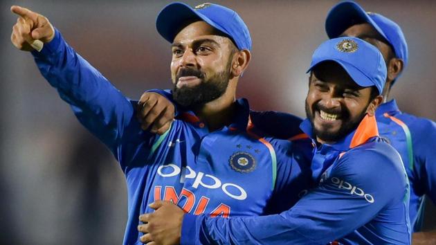 Virat Kohli celebrates with his teammates the dismissal of West Indies' batsman Kieran Powell.(PTI)