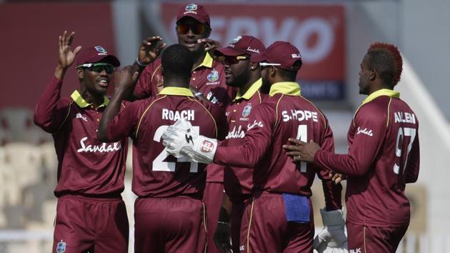 West Indies' players celebrates the dismissal of India's captain Virat Kohli. (AP) 