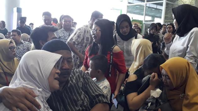 Relatives of passengers comfort each other as they wait for news on a Lion Air plane that crashed off Java Island at Depati Amir Airport in Pangkal Pinang, Indonesia Monday, Oct. 29, 2018. Indonesia disaster agency says that the Lion Air Boeing 737-800 plane crashed into sea shortly after it left Indonesia's capital Monday morning. (AP Photo)(AP)