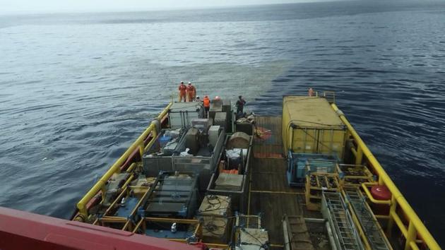 In this photo released by Indonesian Disaster Mitigation Agency (BNPB) rescuers inspect oil slick debris believed to be from Lion Air jet that crashed off West Java. A spokesman for Indonesia’s search and rescue agency said the Lion Air flight, JT610, lost contact 13 minutes after takeoff, adding that a tug boat leaving the capital’s port had seen the craft falling. (BNPB via AP)