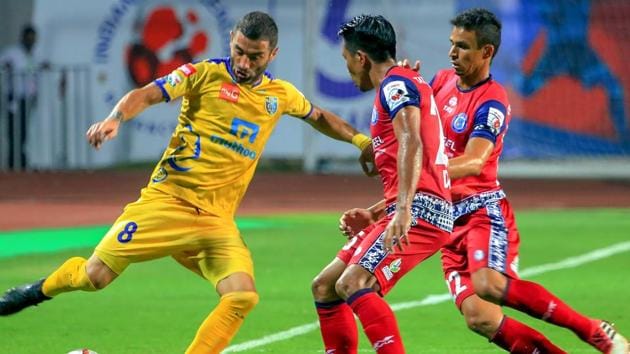 Jamshedpur FC players (red) during a match against Kerala Blasters Football Club players (yellow) in the Indian Super League (ISL) football match.(PTI)