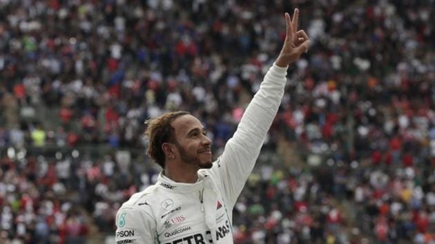 Lewis Hamilton celebrates after winning the World Championship in Mexico on Sunday. (REUTERS) Lewis Hamilton celebrates after winning the World Championship in Mexico on Sunday. (REUTERS)