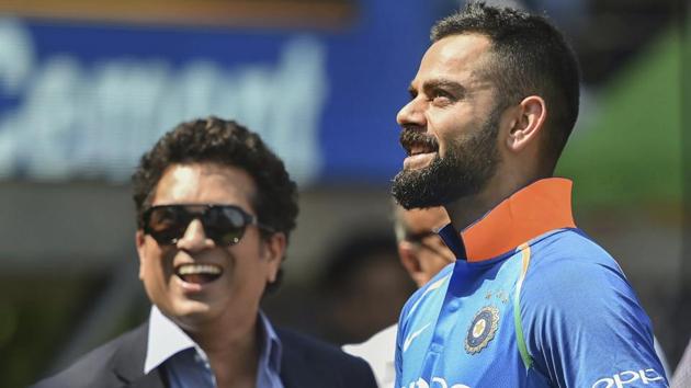 Virat Kohli and former cricketer Sachin Tendulkar before the 4th ODI cricket match. (AP) 