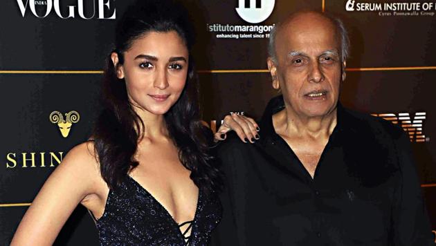 Bollywood actor Alia Bhatt poses for photos with producer Mahesh Bhatt during Vogue Women Of The Year Awards red carpet event, in Mumbai. (PTI) Bollywood actor Alia Bhatt poses for photos with producer Mahesh Bhatt during Vogue Women Of The Year Awards red carpet event, in Mumbai. (PTI)