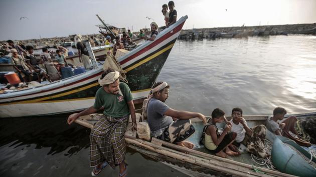 Fishermen rest on their boats before working at the main fishing port, in Hodeida, Yemen. Risking their life, an estimated 300,000 fishermen in Yemen still ply the waters of Yemen’s Red Sea coast, where heavy fighting has been underway for months as the coalition tries to pry the port city of Hodeida — a crucial lifeline for aid — from the Iran-aligned rebels. (Hani Mohammed / AP)