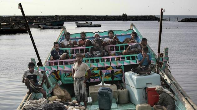 Fishermen take a break and chew Qat, an amphetamine-like stimulant. Fishermen often share advice on Facebook, warning each other to avoid international waters, to stay 5 kilometers from any ships, and to wave white flags or fish in the air if one approaches them. But, it doesn’t always work. (Hani Mohammed / AP)