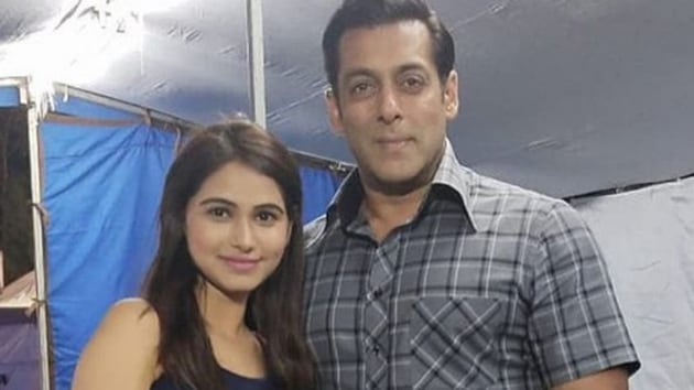 Salman Khan poses with a fan on the sets of Bharat.