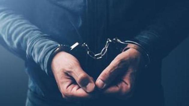Arrested computer hacker and cyber criminal with handcuffs, close up of hands(Getty Images/iStockphoto) Arrested computer hacker and cyber criminal with handcuffs, close up of hands(Getty Images/iStockphoto)
