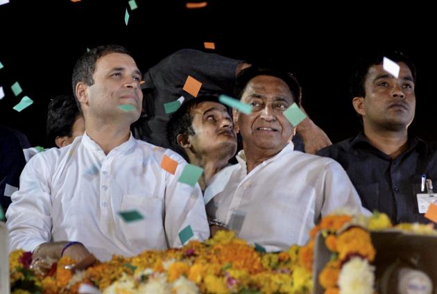 Congress President Rahul Gandhi with party's state president Kamal Nath greet their supporters during a roadshow, in Indore, Monday, October 29 (PTI) Congress President Rahul Gandhi with party's state president Kamal Nath greet their supporters during a roadshow, in Indore, Monday, October 29 (PTI)